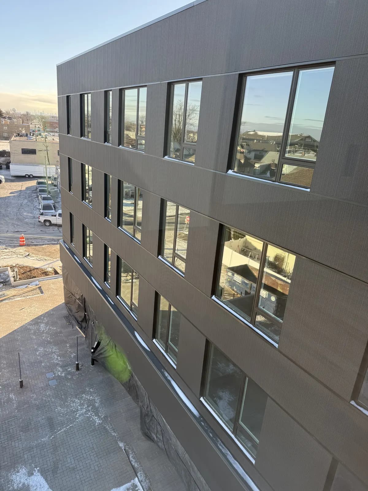 Multi-story building with new dark-frame windows